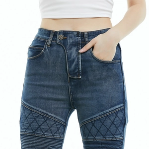 Close-up of women's biker jeans featuring quilted knee panels and horizontal pleats detail