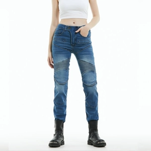 Detail of blue moto jeans showing accordion pleats on knees and slim fit denim texture