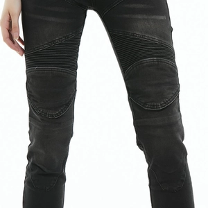 Detail of slim-fit motorcycle jeans featuring pleated stretch panels and reinforced knees