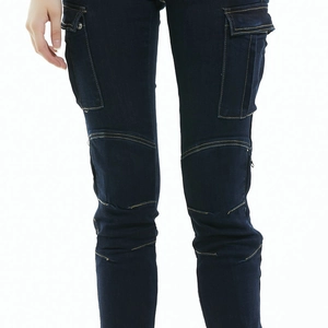 Detail of slim fit motorcycle jeans with cargo pockets and pleated knee structure