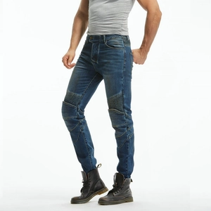 Close-up of pleated biker panels and washed denim texture on blue motorcycle jeans
