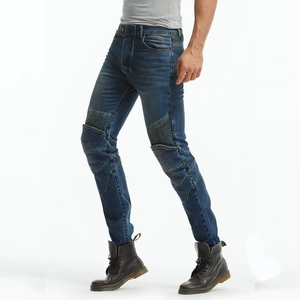 Detail of blue moto jeans showing ribbed stretch panels on knees and thighs for bikers