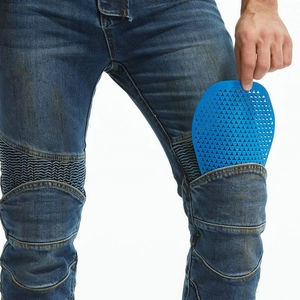 Detail of breathable honeycomb armor being inserted into motorcycle jeans knee pocket
