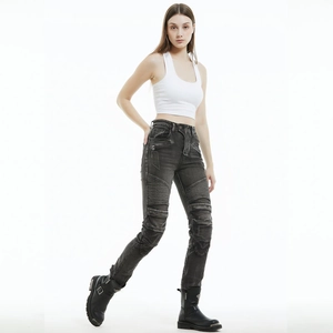 Detail of slim-fit women's motorcycle jeans with biker pleats and patchwork stitching