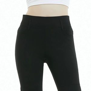 Detail of high waist wide waistband on black motorcycle riding jeans with elastic fit
