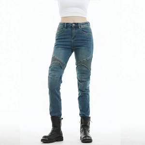 Close-up of blue motorcycle jeans featuring protective knee pleats and slim fit design