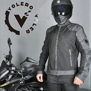 Close-up of black breathable mesh motorcycle jacket with quilted shoulder padding and logo