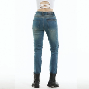 Women's blue denim motorcycle riding jeans with protective design and stretch panels