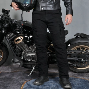 Detail of black tactical motorcycle jeans featuring pleated knee panels and cargo pockets