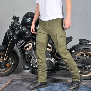 Olive green motorcycle cargo pants with knee pleats and side flap pockets on a rider