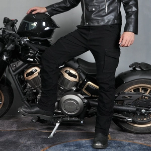 Close-up of motorcycle cargo pants featuring elastic knee pleats and large side pockets