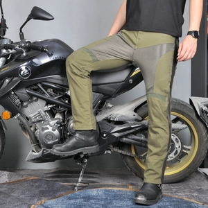 Detail of army green motorcycle pants showing mesh panels and reinforced stitching