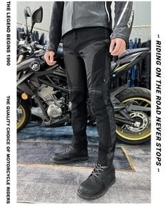 Detail of ergonomic knee padding and reinforced pleated seams on motorcycling jeans