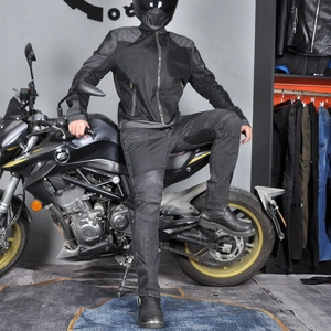 Detail of grey mesh motorcycle riding jacket with reinforced shoulder and stretch pants