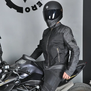 Detail shot of black motorcycle jacket with quilted diamond patterns on the shoulders