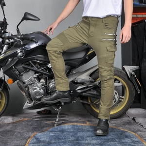 Detail view of military green motorcycle pants with cargo pockets and stretch panels