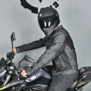 Detail of grey motorcycle riding jacket with quilted shoulders and mesh ventilation