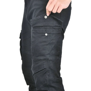 Detailed macro view of motorcycle cargo pants featuring accordion panels and side pocket