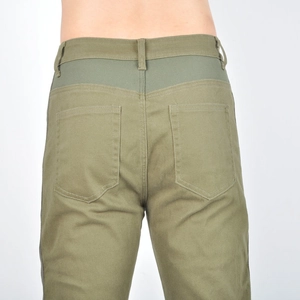 Detail view of army green motorcycle jeans showing rear pockets and reinforced stitching