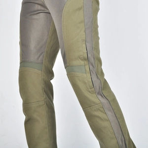 Detail of army green motorcycle pants showing breathable mesh and knee protection layers