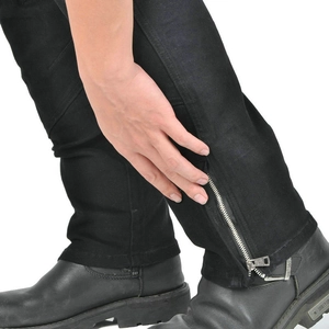 Close-up of adjustable metal zipper on black motorcycle riding pants ankle cuff