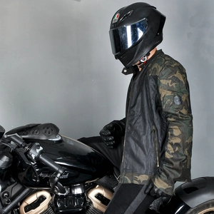 Detail of motorcycle jacket sleeve featuring breathable mesh fabric and camo print