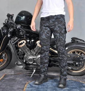 Close-up of camouflage motorcycle jeans with elastic knee pleats and cargo pockets