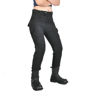 Detail of breathable perforated panels and knee armor on black motorcycle riding pants