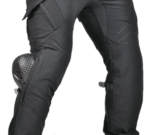 Detail of breathable perforated fabric and protective knee pads on motorcycle riding pants