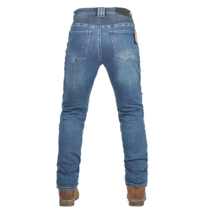 Detail view of washed slim fit motorcycle jeans with leather patch and orange hangtag