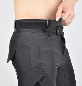 Detail of adjustable waist velcro strap on breathable motorcycle riding pants for men