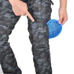 Detail showing the installation of a honeycomb knee protector into camouflage riding pants