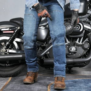 Detail of blue stretch motorcycle jeans with reinforced knee protection and slim fit cut