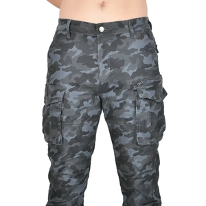 Close-up of grey camouflage motorcycle cargo pants showing large pockets and metal buttons