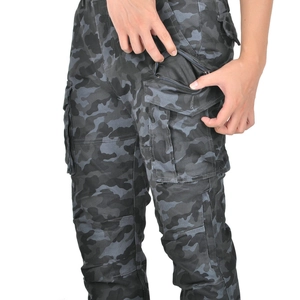 Close-up of camouflage motorcycle cargo pants showing large side pocket and mesh lining