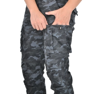 Detail of camouflage motorcycle pants featuring a 3D cargo side pocket with button