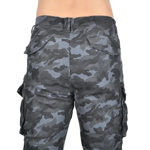 Detail of camouflage motorcycle cargo pants with reinforced pockets and leather back label