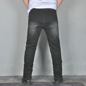 Rear view of men's slim fit motorcycle jeans in washed dark grey denim fabric