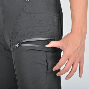 Detail of waterproof zipper pocket on black women's motorcycle riding pants for protection