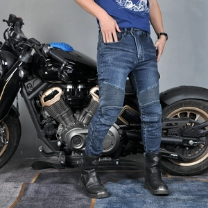 Close-up of flexible accordion stretch panels on the knees of blue motorcycling jeans