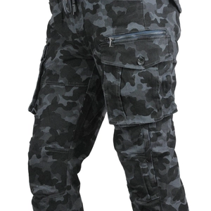 Detail of grey camo motorcycle pants showing large cargo side pocket and metal zipper