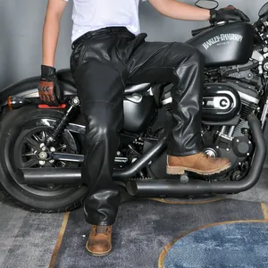 Detail of multi-panel black leather motorcycle pants with knee armor padding