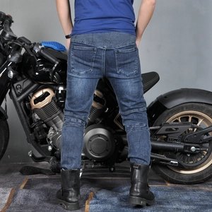 Rear view of durable navy blue motorcycle jeans with ribbed stretch panels and knee pleats