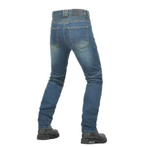 Detail view of motorcycle riding jeans with protective accordion panels and leather logo