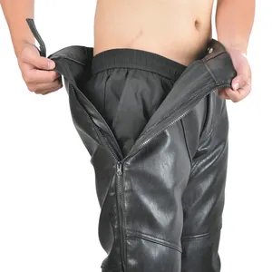 Close-up of black PU leather motorcycle pants with full-length metal zipper detail