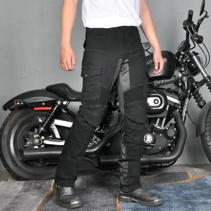 Detail of black motorcycle riding jeans featuring protective knee padding and cargo pockets