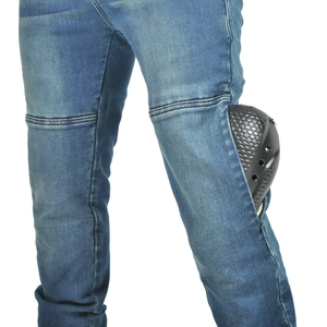 Detail of blue motorcycle jeans with reinforced black honeycomb protective knee pads