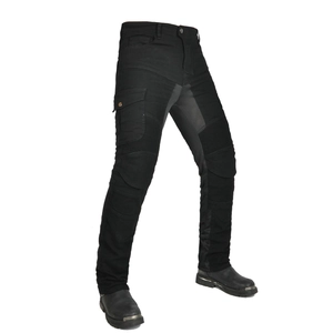 Detail of motorcycle pants featuring accordion stretch panels and cargo pockets for riders