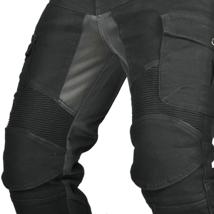 Detail of motorcycle pants with knee armor, breathable mesh panels and elastic pleats