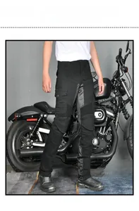 Close-up of black cargo motorcycle pants with accordion stretch panels and utility pockets